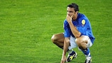 Italy midfielder Massimo Oddo looks dejected at the end of the match