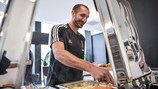 Juventus defender Giorgio Chiellini serves himself lunch during a training camp