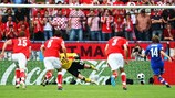 Luka Modrić drives his penalty past the diving Jürgen Macho