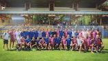 BAK and Corinthian-Casuals players pose for a group photo after the opening game of the inaugural Egri Erbstein Tournament