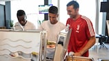 Juventus players Blaise Matuidi , Joao Cancelo and Gianluigi Buffon joke during a lunch in 2019.