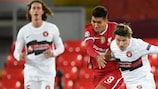 Liverpool's Roberto Firmino tangles with Midtjylland's Anders Dreyer