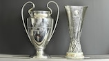 The UEFA Champions League and UEFA Europa League trophies