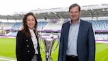 Nadine Kessler and Euronics Group managing director John Olsen pose with the UEFA Women's Champions League trophy