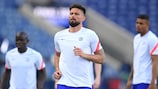 Olivier Giroud limbers up at the stadium on the eve of the final