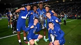 Past UEFA Youth League finalists Tino Anjorin, Callum Hudson-Odoi, Tammy Abraham, Reece James, Mason Mount, Billy Gilmour and Andreas Christensen with the UEFA Champions League trophy