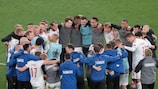 Denmark's jubilant team huddle at full time