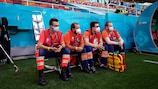 The medical team sit next to the players' bench during the EURO encounter between Austria and North Macedonia in Bucharest
