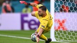 Gianluigi Donnarumma makes a penalty save against Spain