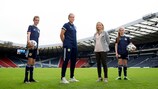 Scotland goalkeeper Lee Alexander (second from left) and Scottish FA's head of girls’ and women’s football Fiona McIntyre (second from right)  with two young supporters, Elle (left) and Erin (right),  at Hampden Park