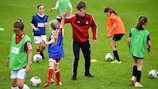 High fives all round as children take to the pitch in Scotland. 
