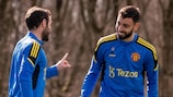 Manchester United's Juan Mata and Bruno Fernandes chat during training on Monday