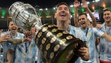 Lionel Messi shows off his first international trophy last summer