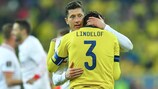 Robert Lewandowski consoles Sweden captain Victor Lindelöf