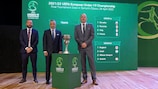 The three confirmed Group B coaches pose with the trophy