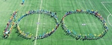 Children in Plungė create a symbolic 100 for Lithuania's football centenary.