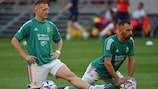 Hungary midfielder László Kleinheisler defender Attila Fiola limber up