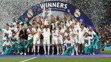 Real Madrid celebrate with the trophy in 2022