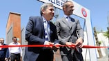 FFA President Armen Melikbekyan (left) and Aleksander Čeferin cut the ribbon to reopen the renovated Abovyan City Stadium