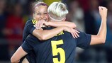 Charlotte Rohlin and Nilla Fischer celebrate one of Sweden's five goals against Finland in 2013