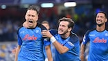 Napoli midfielder Piotr Zieliński celebrates his early penalty against Liverpool - the beginning of an incredible night