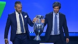 Gianluca Zambrotta and Demetrio Albertini carry the trophy to  the UEFA EURO 2024 qualifying draw