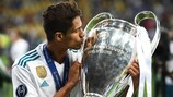 Raphaël Varane celebrates with the Champions League trophy in 2018