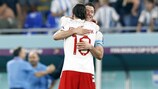 Robert Lewandowski celebrates after learning of Poland's qualification despite the loss to Argentina 