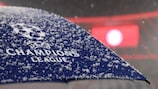 A UEFA Champions League umbrella protects against snow