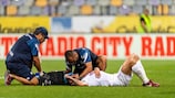 The CFR Cluj medical  team treats Andrei Burca during a UEFA Europa Conference League Qualifier  match 