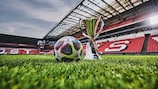 The official match ball for the knockout stages  of the 2022/23 UEFA Women's Champions League pictured alongside the trophy at Eindhoven's PSV Stadium, venue for this season's final