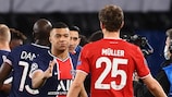 Kylian Mbappé and Thomas Müller following Paris’s 2021 meeting with Bayern