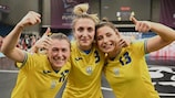 Ukraine's double goalscorer Anna Shulha (centre) celebrates with Iuliia Forsiuk (left) and Iryna Dubytska (right)