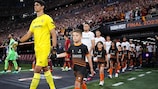 Yassine Bounou of Sevilla FC leads the team out alongside young mascots prior to the UEFA Europa League 2022/23 final.