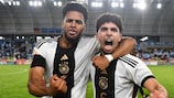 Almugera Kabar and Fayssal Harchaoui celebrate Germany's success