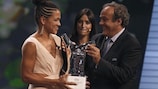 Celia Šašić receives her UEFA Best Women's Player in Europe Award from UEFA President Michel Platini