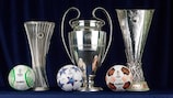 The UEFA Europa Conference League, UEFA Champions League and UEFA Europa League trophies, along with the competitions' respective official match balls