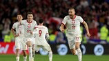 CARDIFF, WALES - MARCH 26: Krzysztof Piatek and Bartosz Salamon of Poland celebrate victory in the penalty shoot out during the UEFA EURO 2024 Play-Offs Final match between Wales and Poland at Cardiff City Stadium on March 26, 2024 in Cardiff, Wales. (Photo by Richard Heathcote/Getty Images)