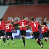 Georgia's players celebrate winning the UEFA EURO 2024 qualifying play-off final against Greece