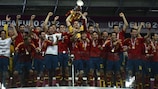 Spanish players celebrate with the trophy after winning EURO 2012
