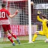 Antonios Papakanellos scores for Olympiacos against Bayern in the quarter-finals