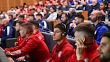 Olympiacos players listen  to interpreters during Saturday's UEFA Youth League education session