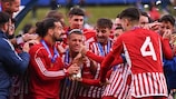 Watch Olympiacos lift trophy