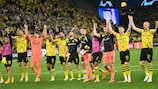 Dortmund players celebrate with their fans after the UEFA Champions League semi-final first leg football match between Borussia Dortmund and Paris Saint-Germain (PSG) on May 1, 2024 in Dortmund. (Photo by INA FASSBENDER / AFP) (Photo by INA FASSBENDER/AFP via Getty Images)