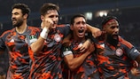 Olympiacos celebrate scoring their fourth goal at Aston Villa